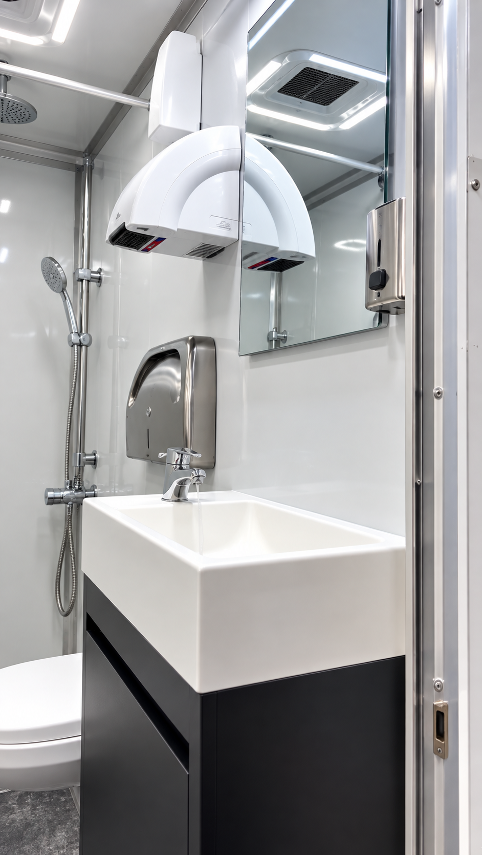 Sink and vanity inside a six-stall shower-restroom combination trailer